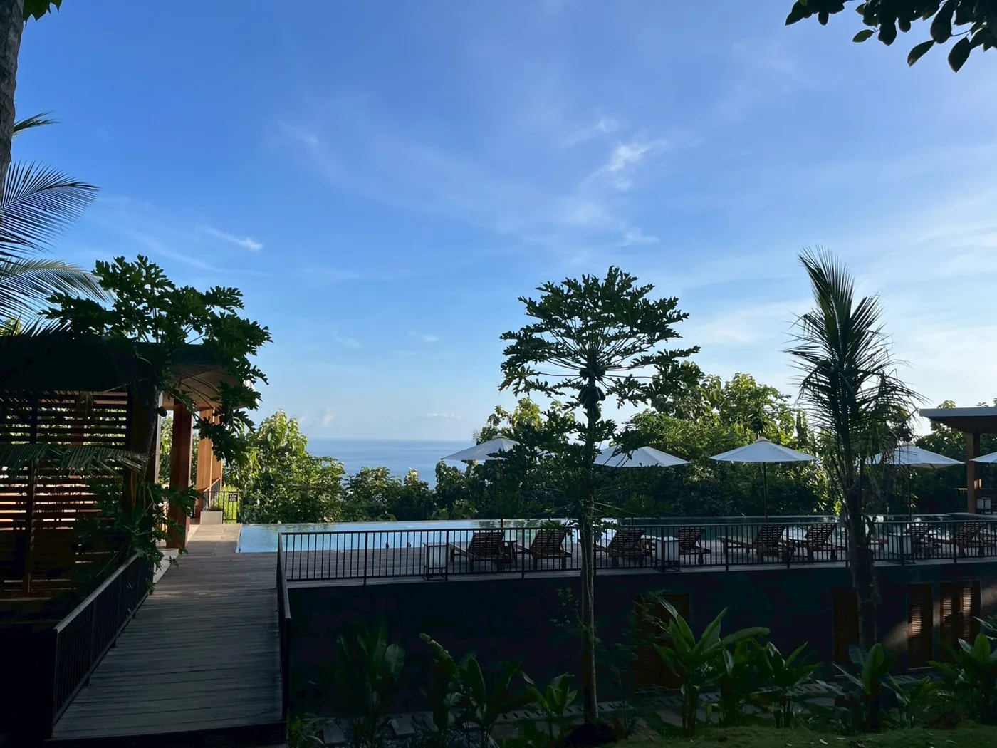 A wooden deck at a nearby resort looking out to the sea